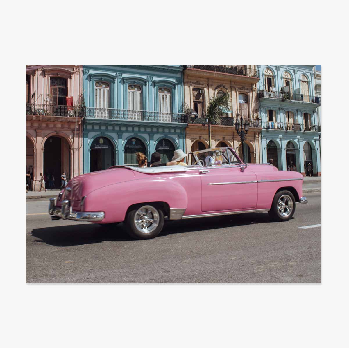 Vintage pink car on the street poster
